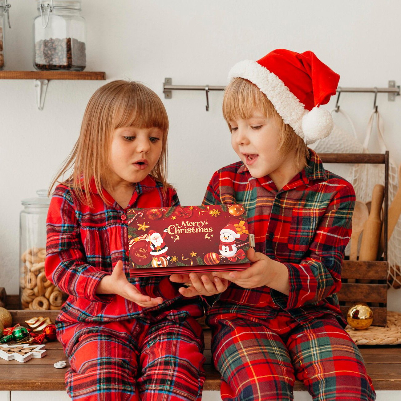 Children holding Christmas cash gift envelope