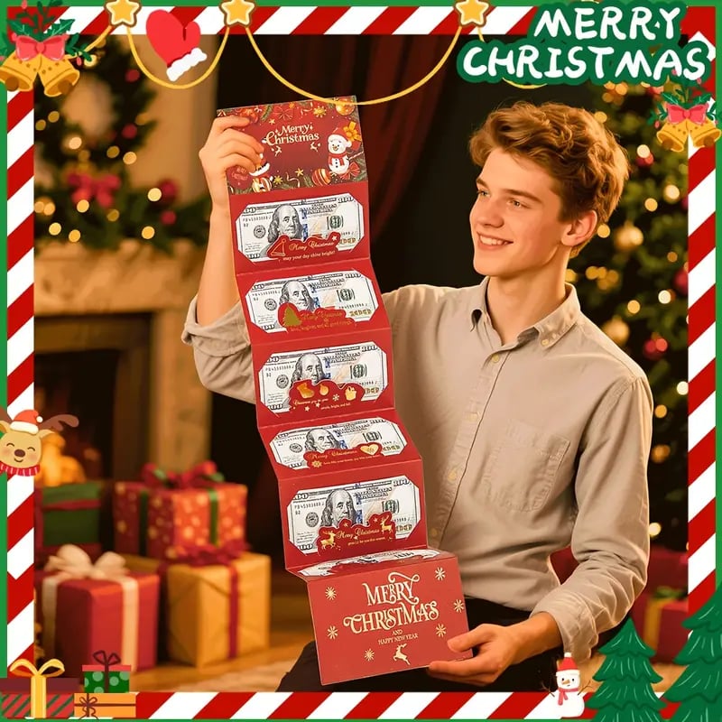 Young man holding unfolded Christmas cash gift envelope